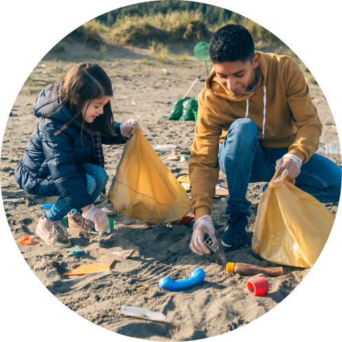 Two people at a beach cleanup